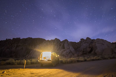 Scenic view of road against sky at night