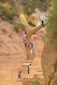 High angle view of people walking on road