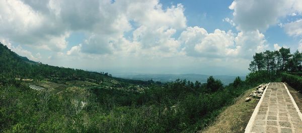 Scenic view of landscape against cloudy sky