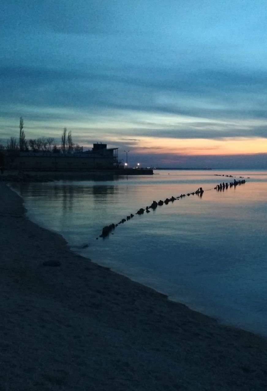 water, sky, sunset, sea, nature, cloud - sky, tranquil scene, scenics - nature, beach, tranquility, reflection, beauty in nature, land, architecture, dusk, no people, built structure, outdoors, silhouette