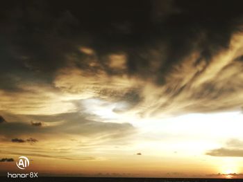 Low angle view of dramatic sky during sunset