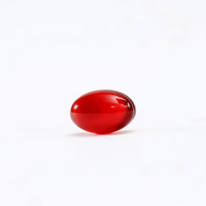 Close-up of red apple against white background