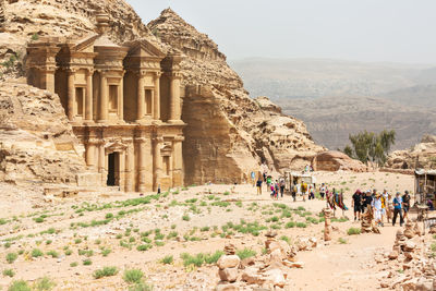 People walking on rock formations