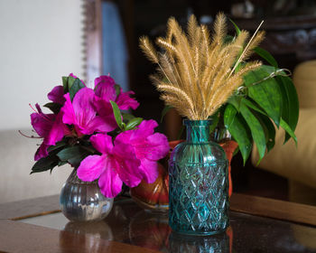 Close-up of flower vase on table at home