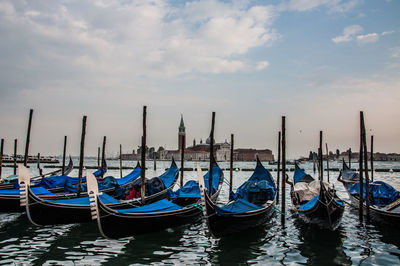 Boats moored in canal