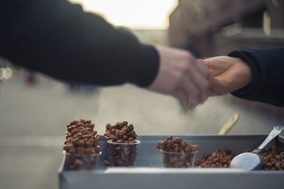 Close-up of man preparing food