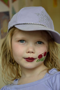 Close-up portrait of girl with face paint