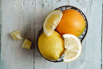 Citrus fruits prepared in a metal basket for summer cocktails