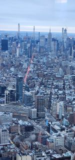 Aerial view of townscape against sky