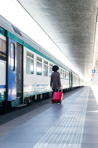 Elegant woman going for business trip on train