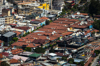 Residential area in a tropical country with many similar houses with water barrels 