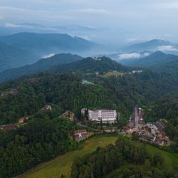 High angle view of buildings and mountains against sky