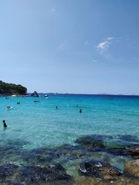 Scenic view of sea against blue sky