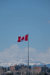 Red flag against blue sky