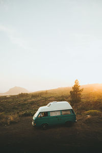 View of car on field against sky