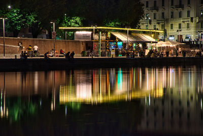 Group of people in front of building at night