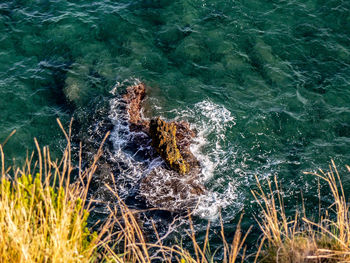 High angle view of water splashing in sea