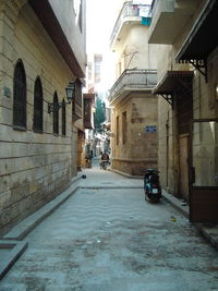 Street amidst buildings in city during winter