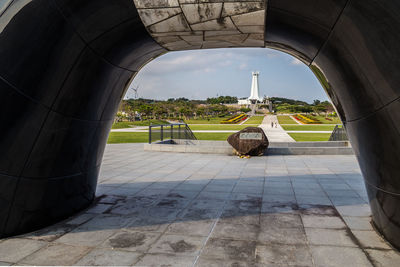 View of historic building seen through archway