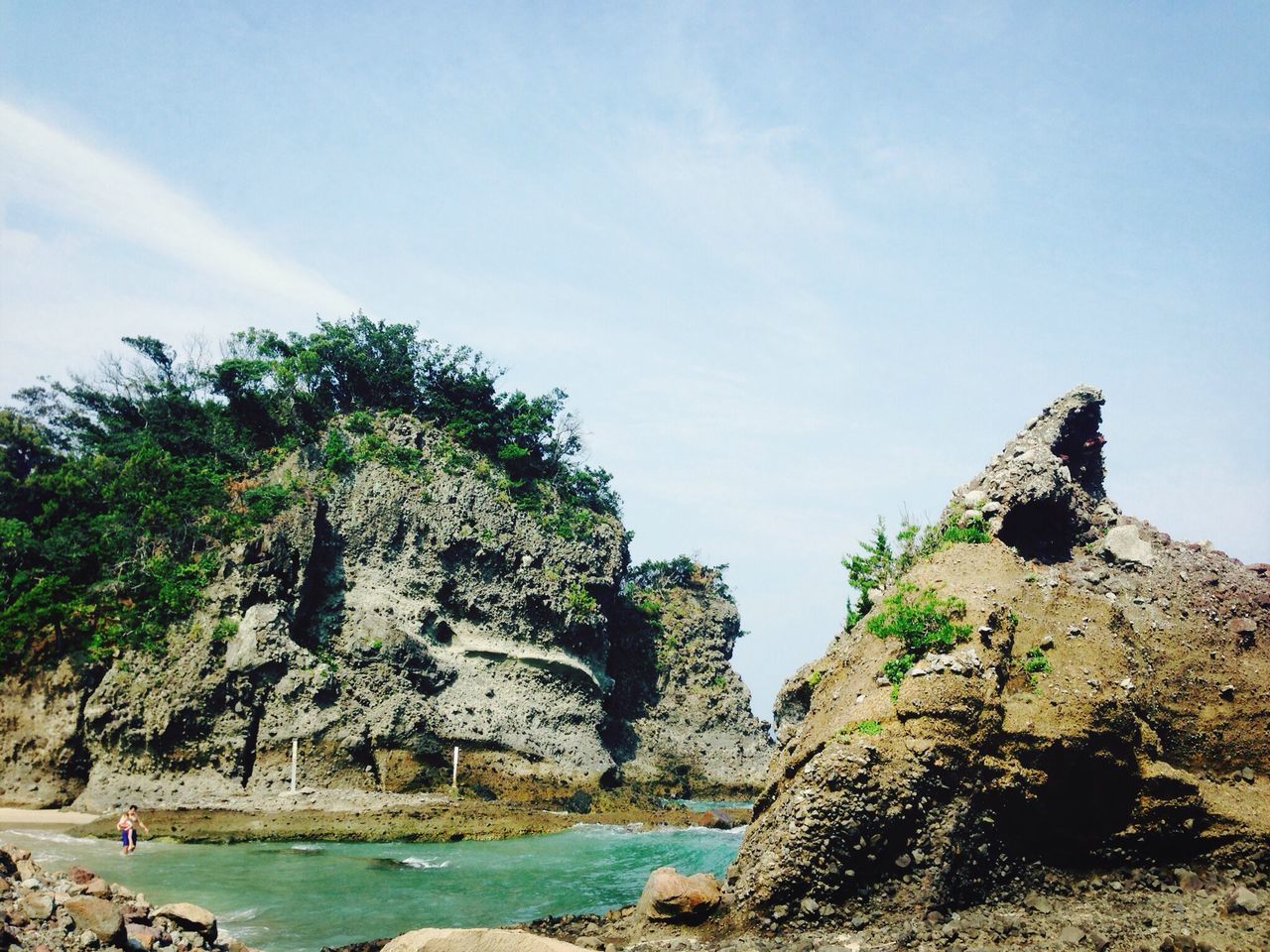 rock - object, sky, tranquility, rock formation, tranquil scene, tree, scenics, nature, beauty in nature, sea, water, cliff, rock, blue, day, idyllic, growth, non-urban scene, outdoors, rocky mountains