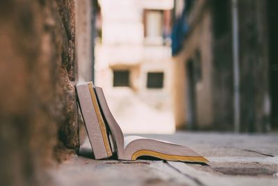 Close-up of open book on street