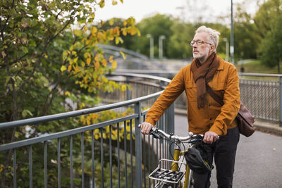 Mature man with bicycle