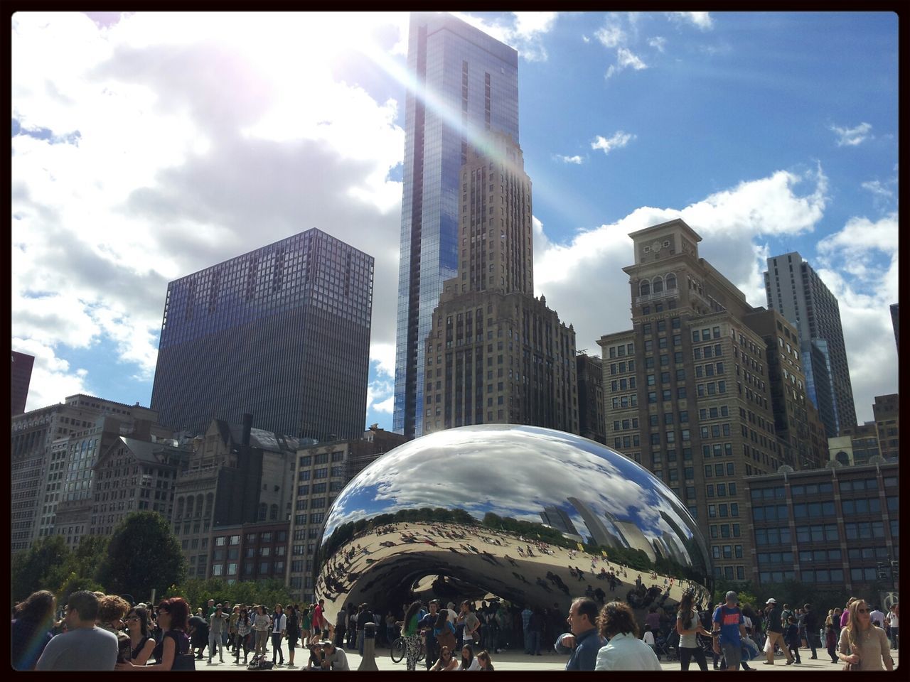 architecture, built structure, building exterior, city, sky, famous place, large group of people, travel destinations, international landmark, transfer print, capital cities, cloud - sky, tourism, travel, city life, men, tourist, cloud, person