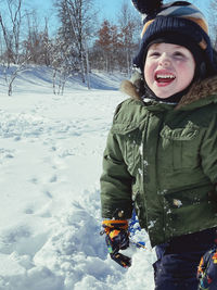 Portrait of woman skiing on snow