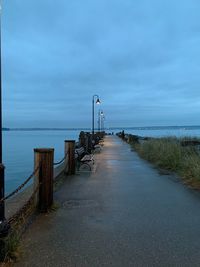 Pier over sea against sky