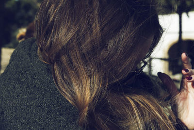 Close-up of girl with arms raised