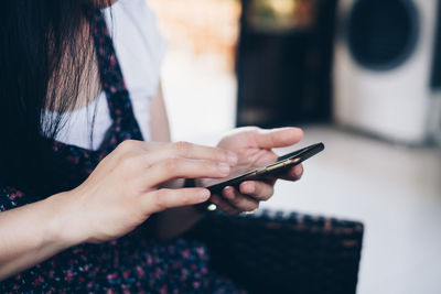 Close-up of woman using mobile phone