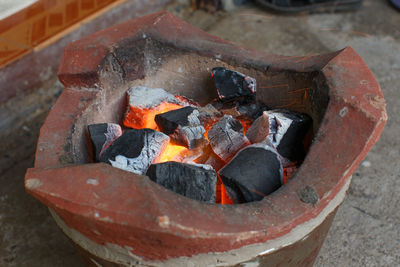 High angle view of fire on wood