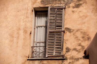 Closed window of old building