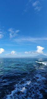 Scenic view of sea against blue sky