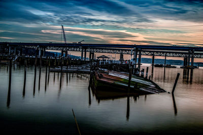 Pier at harbor against sky