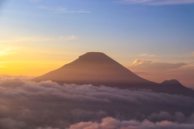 Scenic view of mountains against sky during sunset