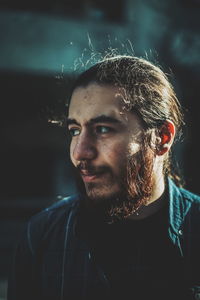 Portrait of young man looking away