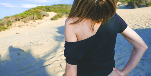 Sensuous woman at sandy beach