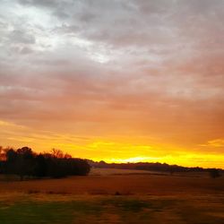 Scenic view of dramatic sky during sunset