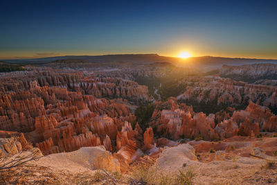 Scenic view of sunset over rock formations