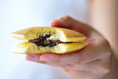 Cropped image of hand holding dorayaki