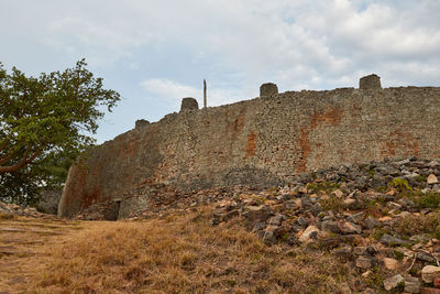 Low angle view of fort against sky