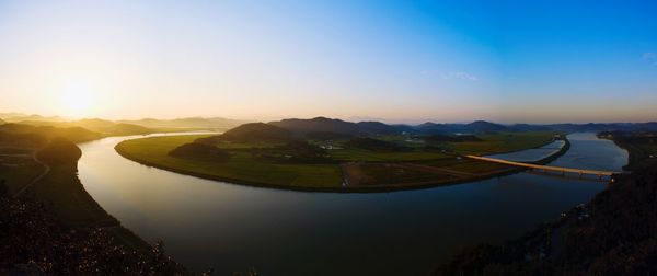 Scenic view of lake at sunset