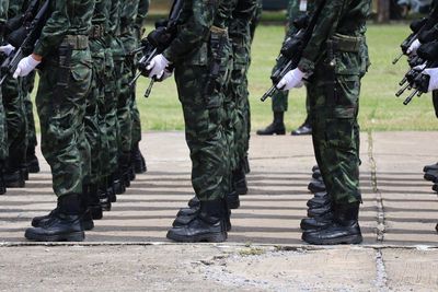 Low section of soldiers standing on street