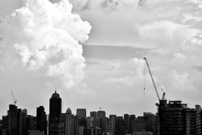 Modern buildings in city against sky