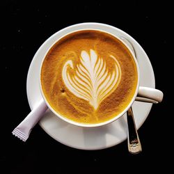 High angle view of cappuccino on table