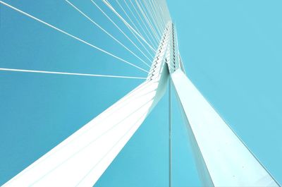 Low angle view of bridge against clear blue sky