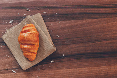 High angle view of bread on cutting board