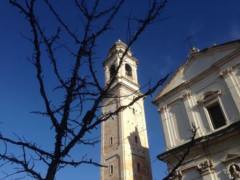 Low angle view of bell tower against sky