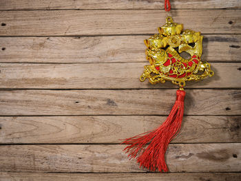 Close-up of rope tied on wooden wall